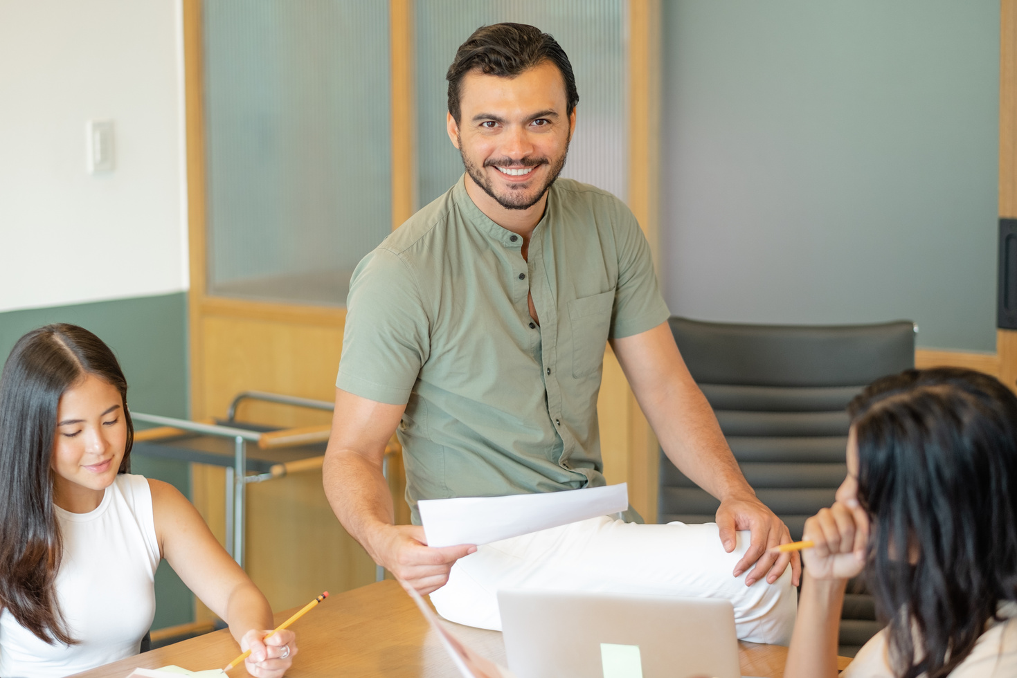 Man Working in the Office with Colleagues